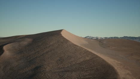 aerial view on big sand dunes in sahara desert at sunrise