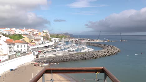 marina and dredging vessels on the bay of angra in angra do heroismo, terceira island, portugal