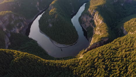 aerial view of a winding river through a canyon