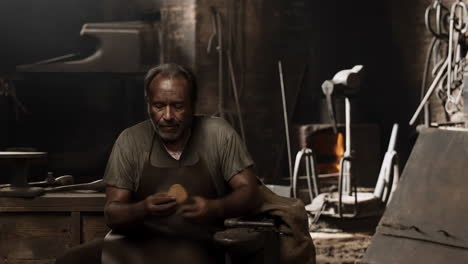 blacksmith working in his workshop