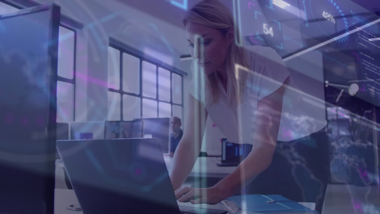 Animation of data processing over caucasian businesswoman working in office