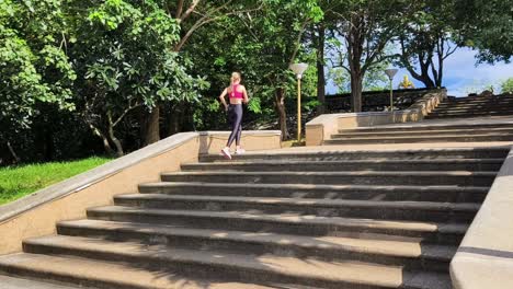 woman running upstairs in a park