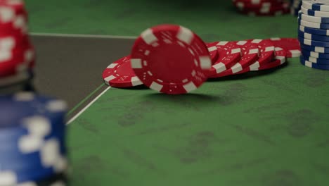 Close-up of poker chips on a green casino table