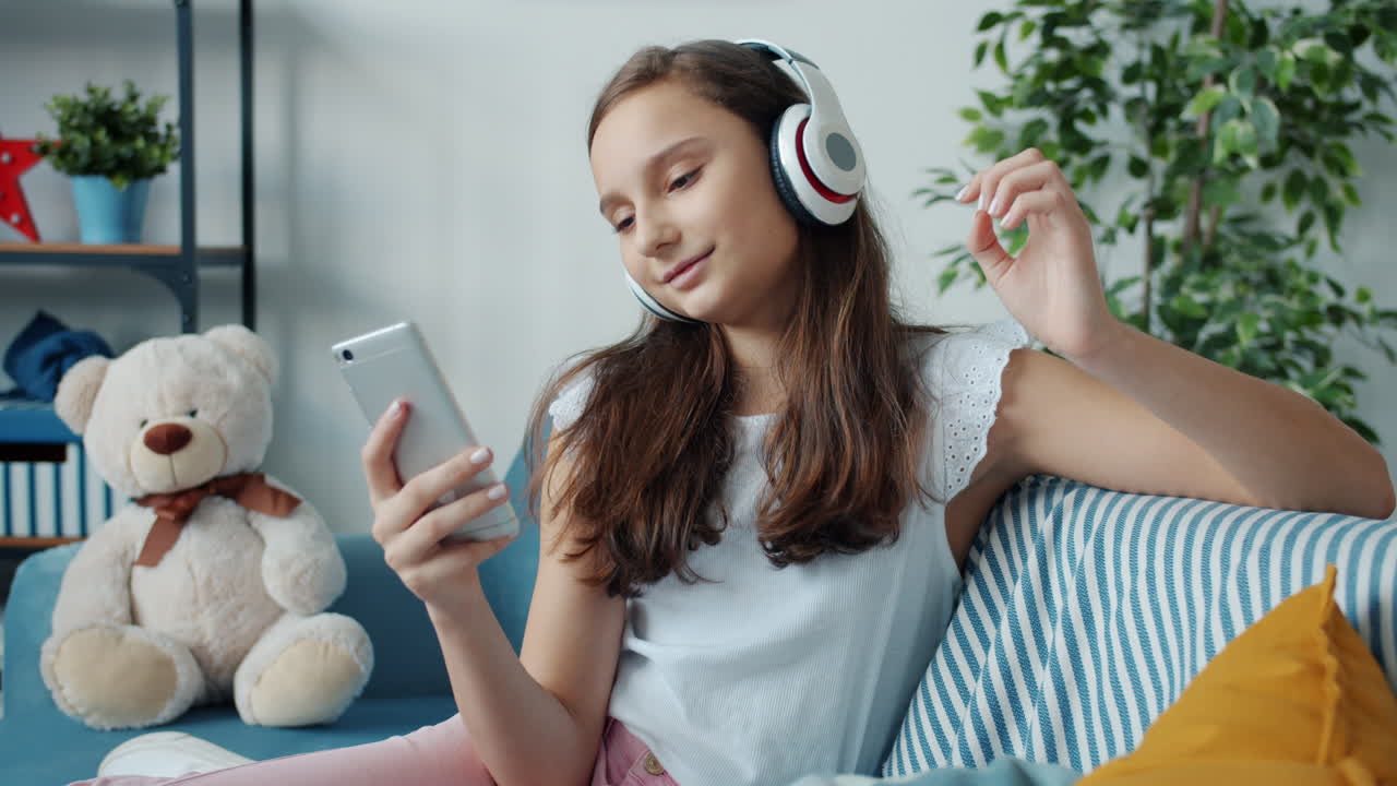 Teenage Girl Listening to Music on Phone
