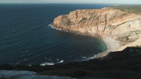 rocky coast and ocean view around cabo espichel lighthouse in portugal