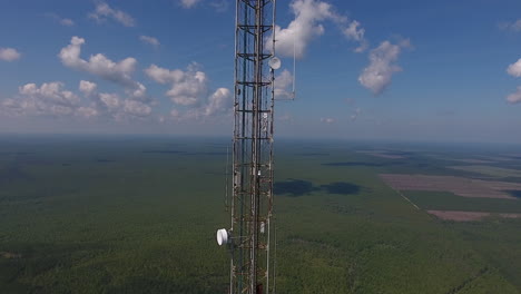 a drone shot moving close to a communication tower