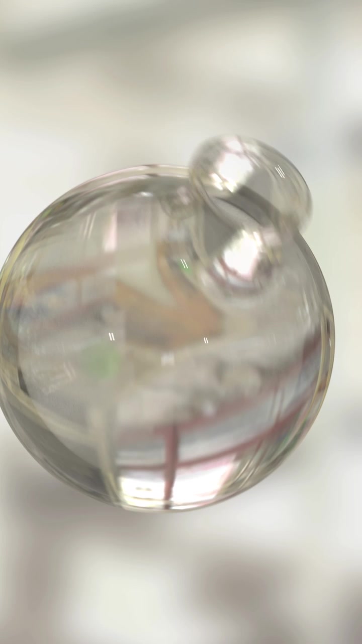 Animazione di una bottiglia di vetro che gira su sfondo di laboratorio