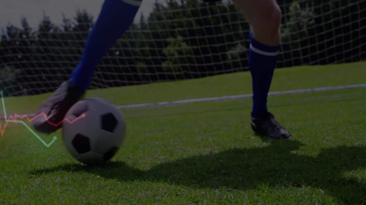 Mengontrol bola sepak di lapangan, pemain dengan animasi hamparan grafik data.