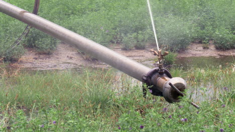 sprinkler head of a rolling irrigation system rotating slowly right