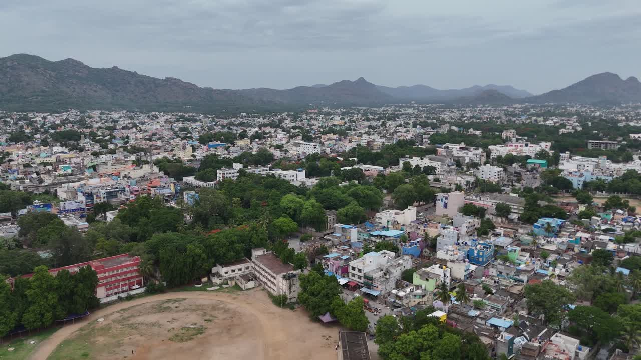 Panoramic Aerial View of a South Asian City with Mountains and Urban Landscape