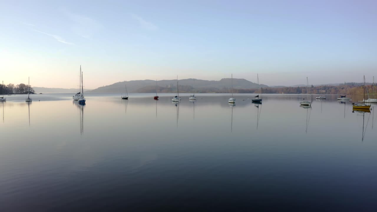 Drone footage of sailing boats early morning near Bathray Bay, Lake Windermere, the English Lake District, UK