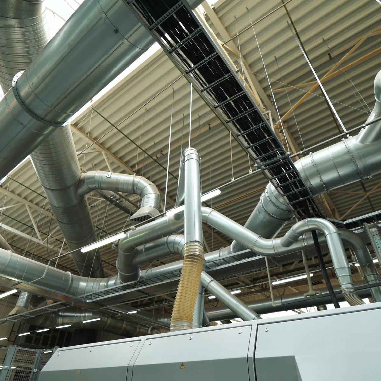 modern branch of the ventilation system inside the floorboard manufacturing plant. Innovative technology of woodworking plant