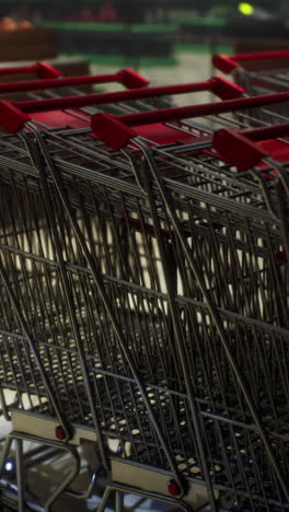 stacked shopping carts in a supermarket