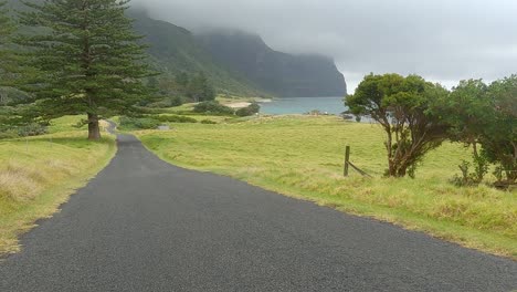 driving down a sealed road towards mt gower in the background on lord howe island