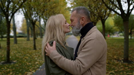 Senior-woman-and-bearded-man-cuddling