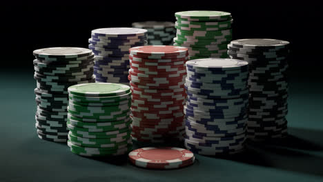 casino tokens or chips arranged in piles on a green poker table. video showing poker chips in neat stacks. can represent gambling, luck, success, las vegas, money, victory, win, jackpot. 4k