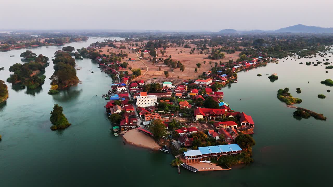 Don Det island in the Si Phan Don region, southern Laos,with braided section of Mekong River with islets, channels, rice fields, and the village core flanked by tropical vegetation and rural trails