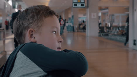 child on moving walkway at the airport