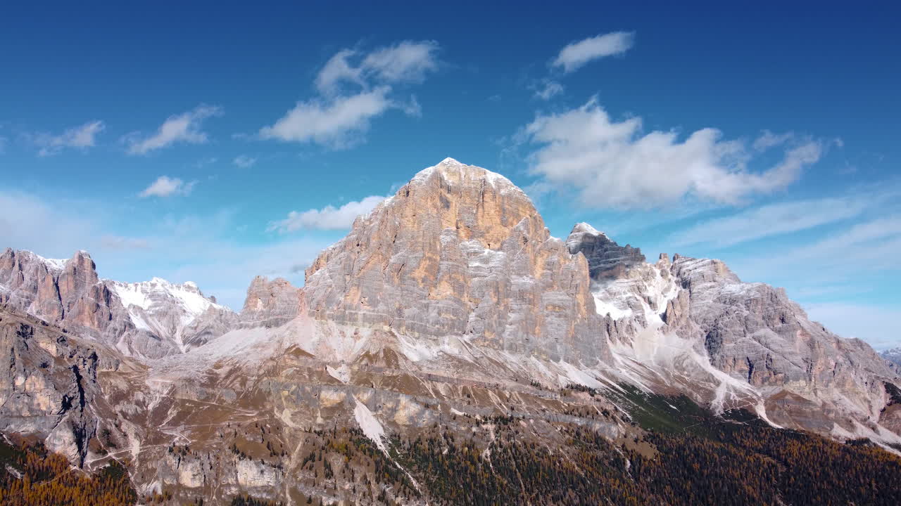 Aerial view of the Dolomites. Tofane. Hike near the Giau Pass, Cinque Torri, Cortina. Mountains in autumn with the first snow on the peaks