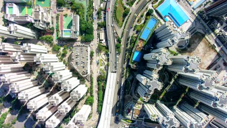 hong kong downtown kowloon urban area, top down aerial view with traffic and city skyscrapers