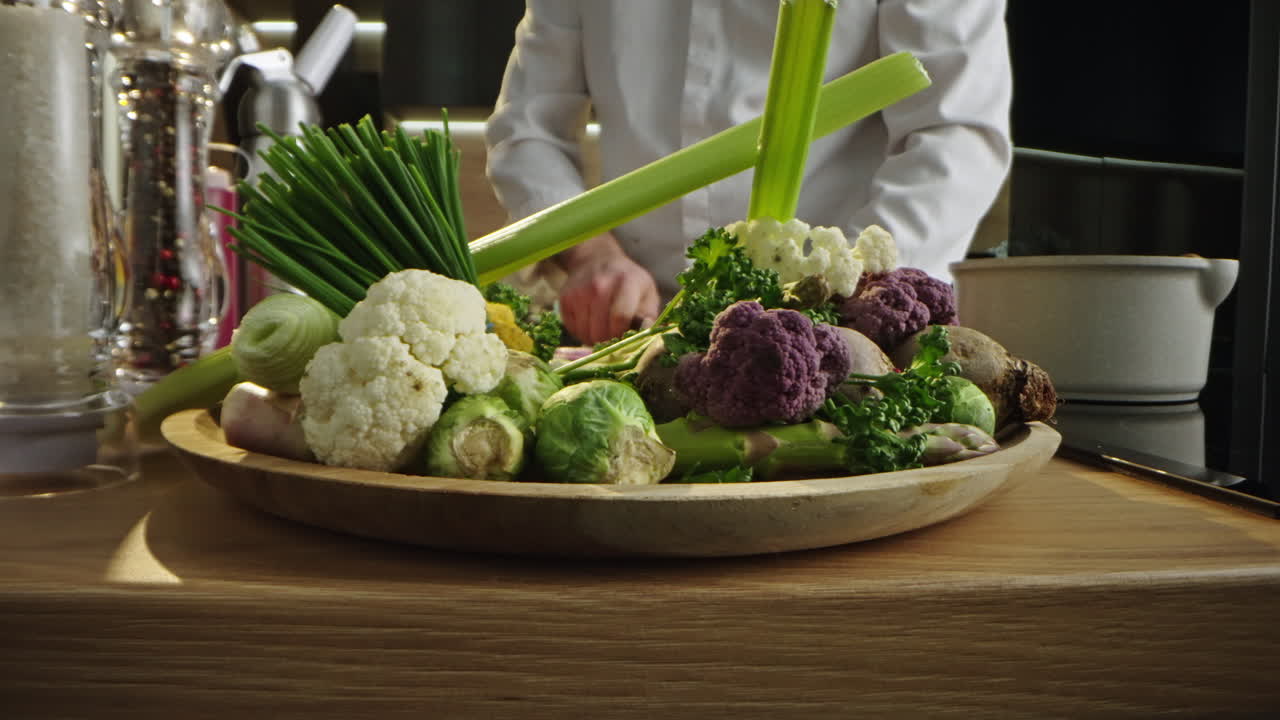 Chef slicing red onion in the kitchen