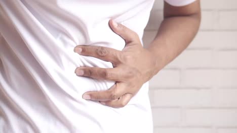 man experiencing abdominal pain