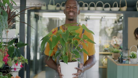friendly florist holding a plant