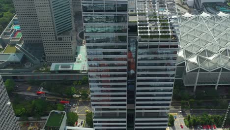 day time flight over singapore city center office complex aerial topdown panorama 4k