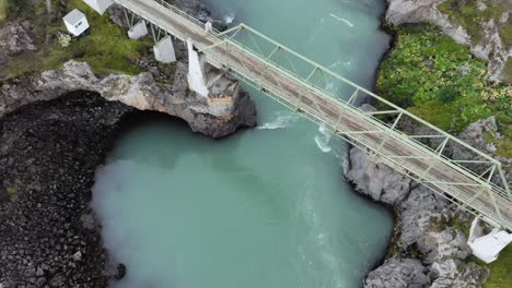 top down aerial of godafoss glacier blue green waterfall in iceland