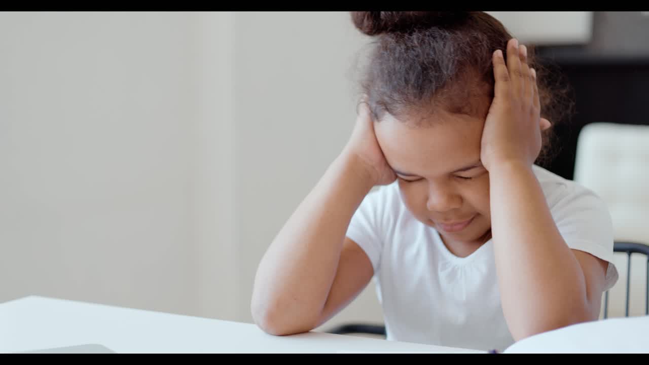 Young Girl Struggling with Homework