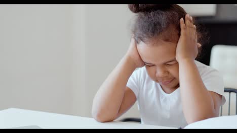 young girl struggling with homework