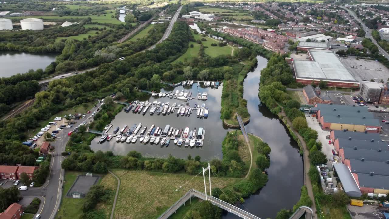Kings Marina in Newark. High drone video shows the marina and the surroundings in Newark. The drone moves forward and rotates, focuses on the marina.