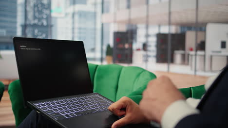 vertical video bucharest, romania - july 30th 2024 - young ceo using netflix to relax in office