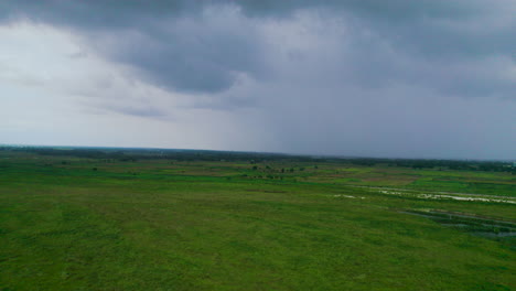 Drone-shot-of-Doomed-cloudy-sky-above-the-plain-ground-somewhere-around-Nepal