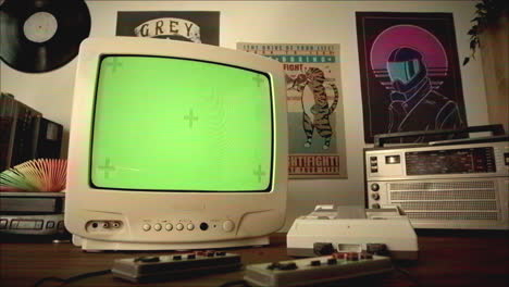 retro gaming setup with green screen tv