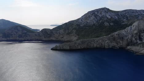 Aerial-Pan-View-Of-Cliffs-Of-Cap-De-Formentor-With-Calm-Blue-Seas