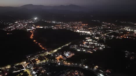 Nocturnal-Aerial-Vistas,-Huatulco\'s-Heart,-La-Crucecita,-Oaxaca,-Mexico