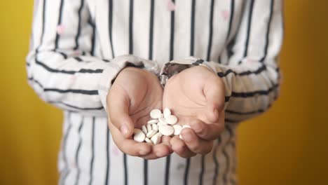 child holding pills