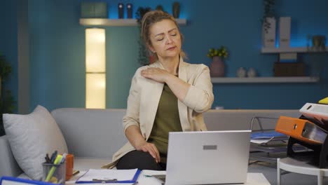 home office worker woman has shoulder pain.