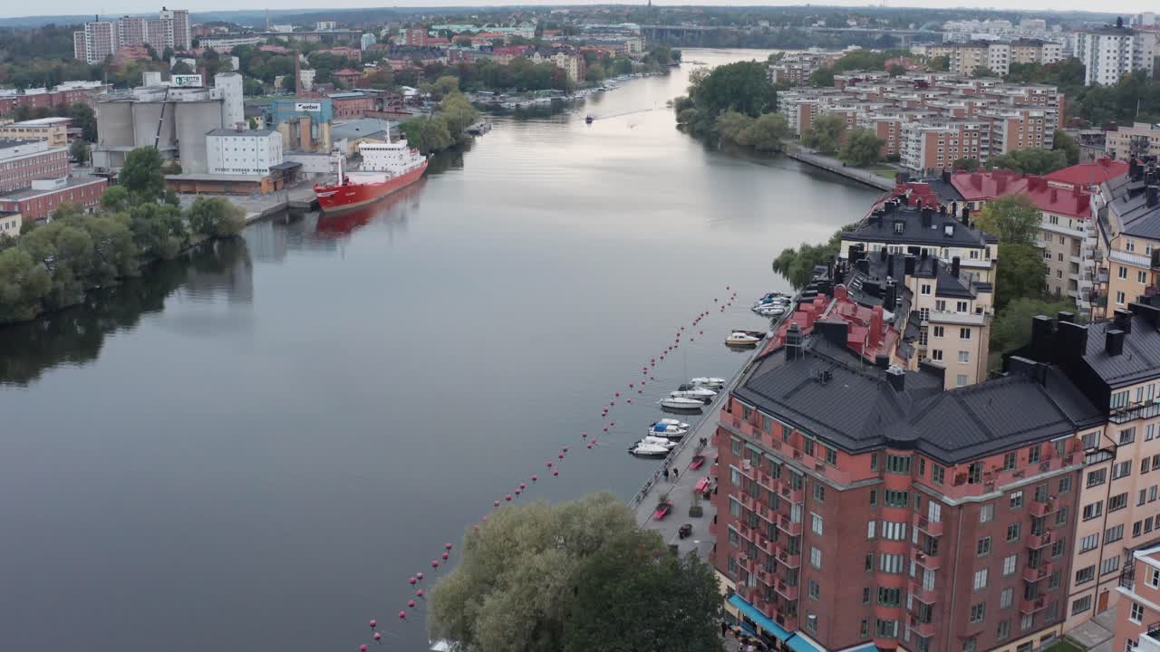 Apartment buildings by canal during sunset in S&ouml;dermalm, Stockholm, Sweden