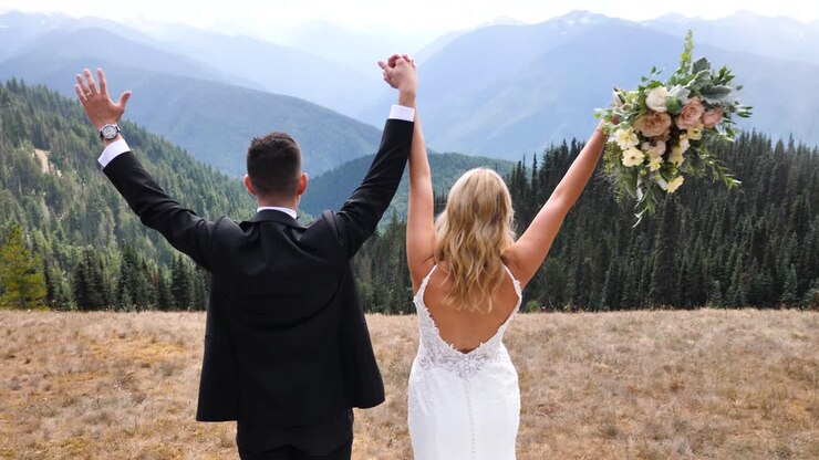 Happy groom and bride at their wedding in the mountains