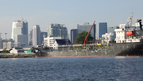 ship moves across urban waterfront skyline