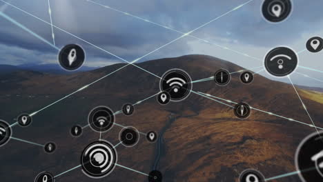 Animation-of-network-of-connections-with-icons-over-landscape