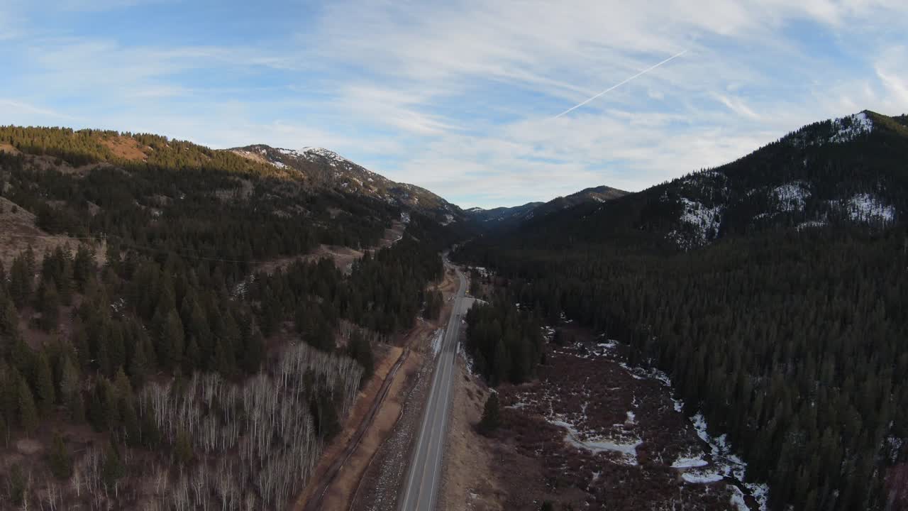 Aerial view of a road between two hills