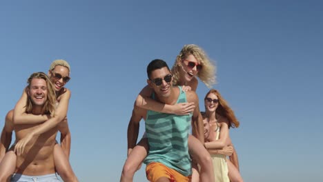 young adult friends having fun at the beach 4k