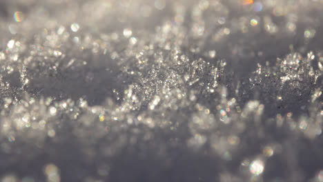 Super-close-up-macro-shot-of-ice-crystals-slowly-melting-in-the-sun