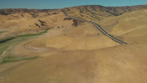 aerial of san luis reservoir hills during midday