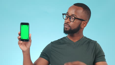 Phone,-green-screen-and-pointing-to-a-screen