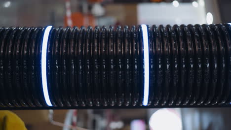 tube with glowing led rings changing colors in shopping mall