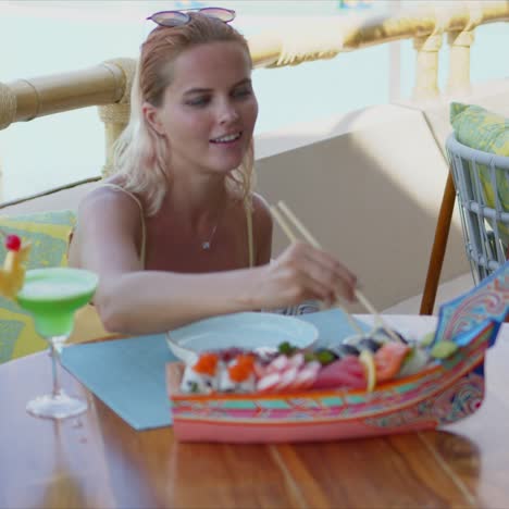 Delighted-female-resting-in-restaurant-on-resort